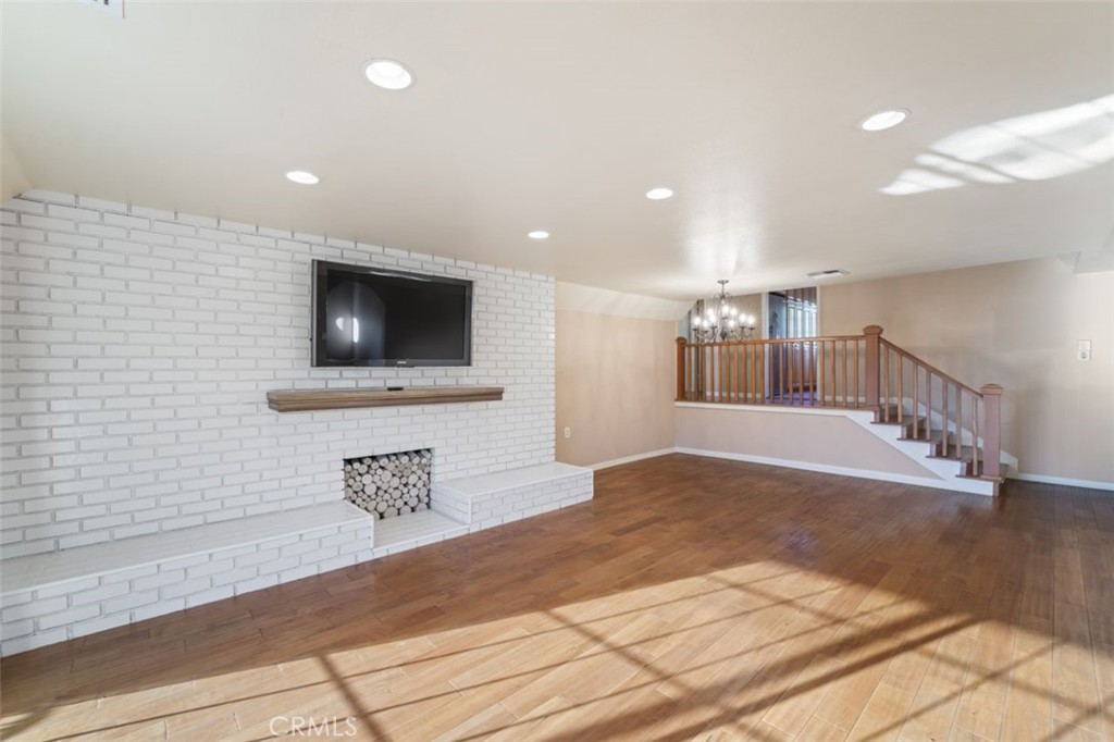 7223 Tranquil Place Tujunga, CA 91042 - Photo 31 of 40 a view of a livingroom with wooden floor and a flat screen tv