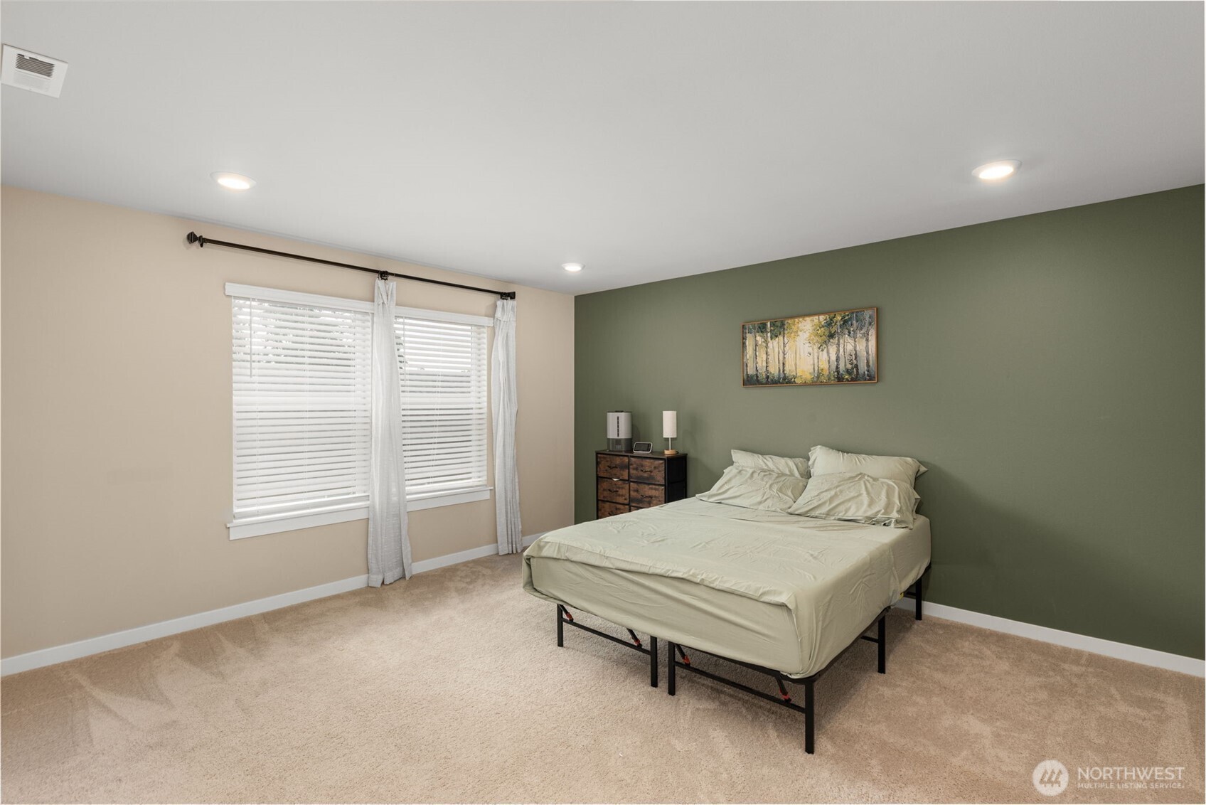 19410 28th Drive Southeast Bothell, WA 98012 - Photo 31 of 37 a bedroom with a bed and a table in it