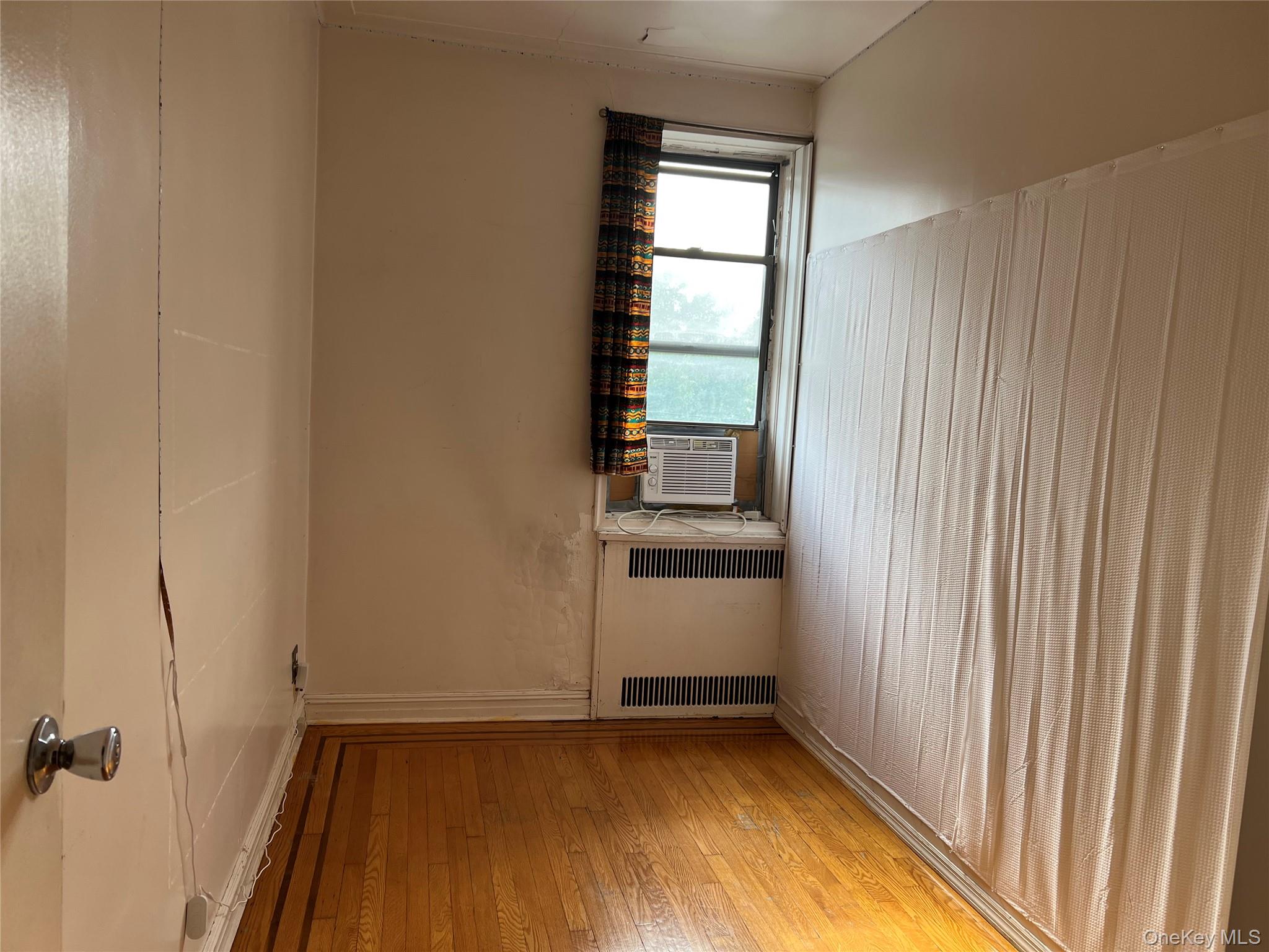 40-35 Ithaca Street, Unit 3D Queens, NY 11373 - Photo 6 of 9 a view of an empty room with a window