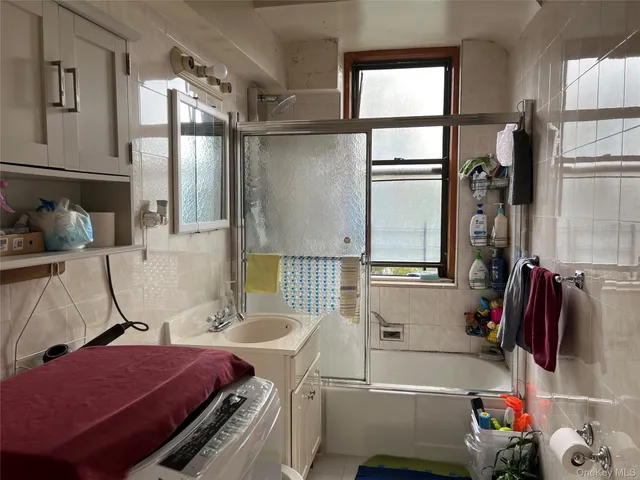 a bathroom with a sink a bath tub and a shower