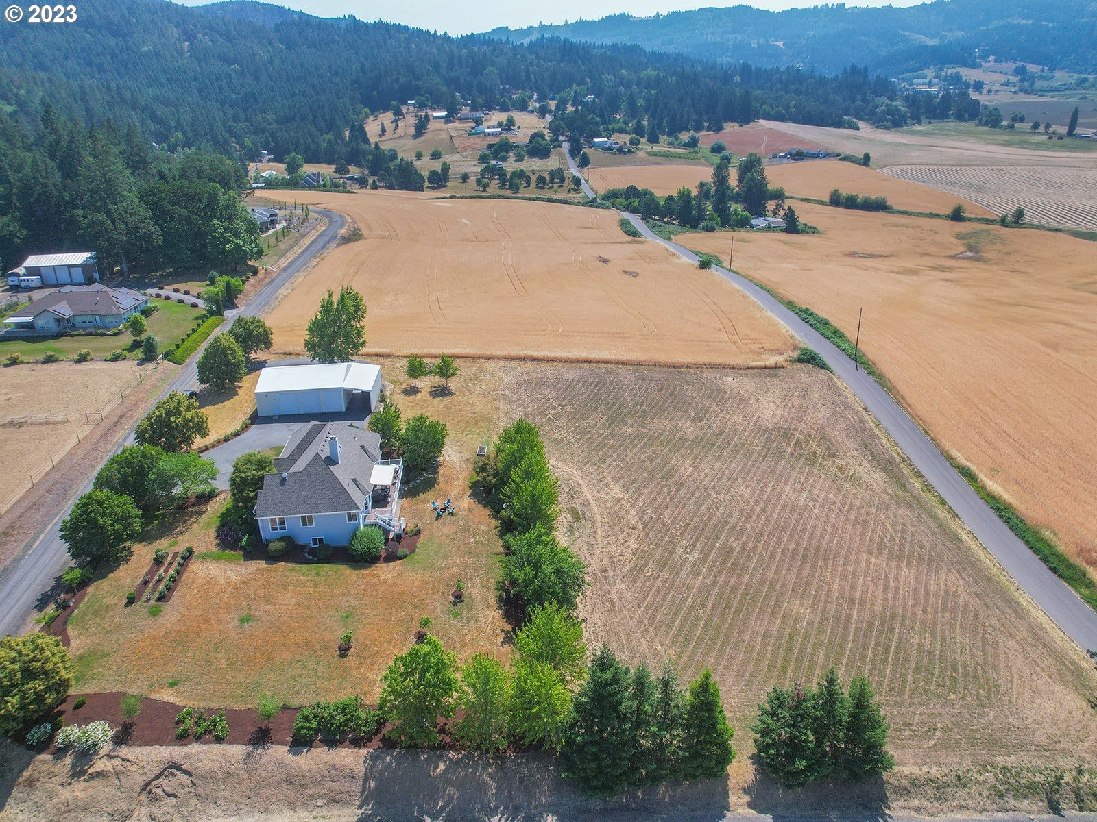 41330 Southwest Edna Lane Gaston, OR 97119 - Photo 45 of 46 an aerial view of a house with a garden and mountain view