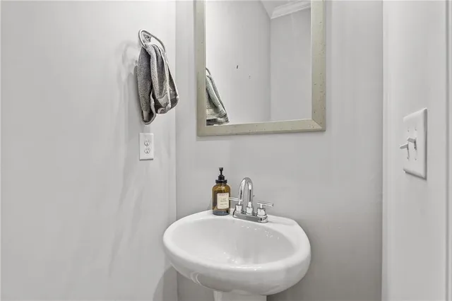 a bathroom with a sink and mirror