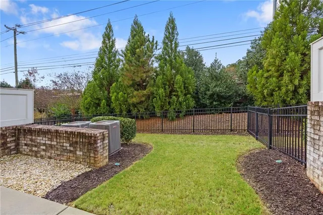 a view of a backyard with a small cabin
