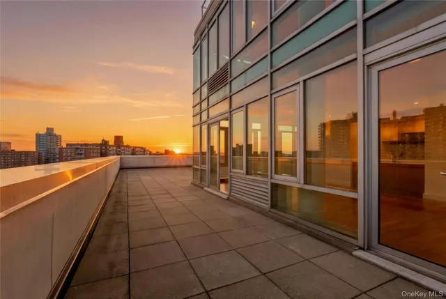 a view of an entryway with wooden floor and a window