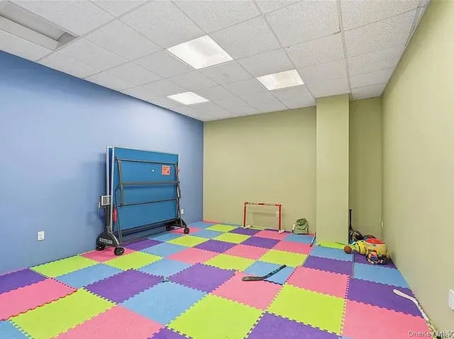 a living room with furniture and a table
