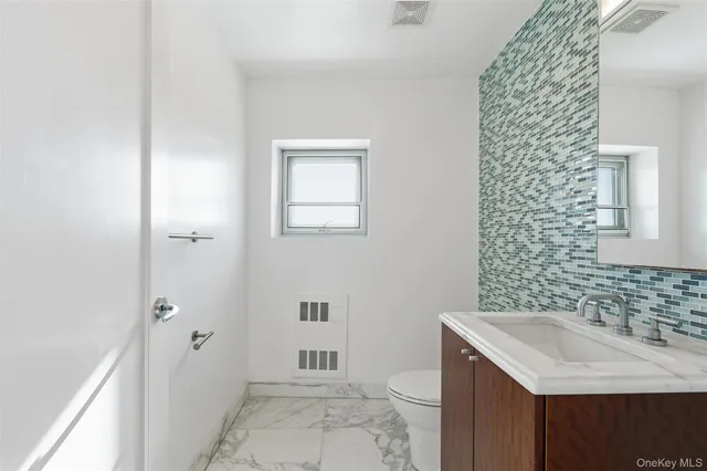 a bathroom with a sink and a toilet