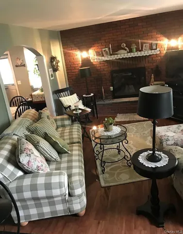 a living room with furniture and a lamp