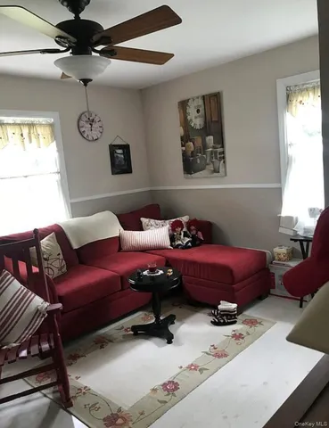 a bedroom with furniture and window