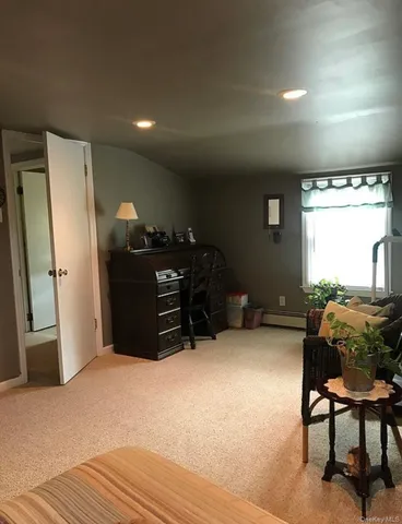 a bed room with furniture and a window