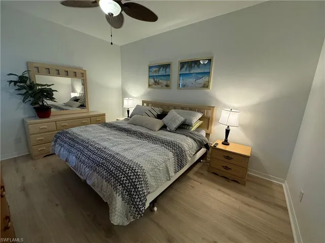 a bedroom with bed and window