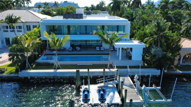 a front view of house with yard and outdoor seating