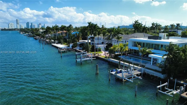 an aerial view of a house with outdoor space lake view and boat