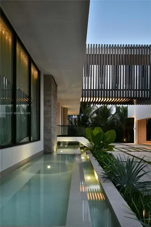 a view of a chairs and table in a patio