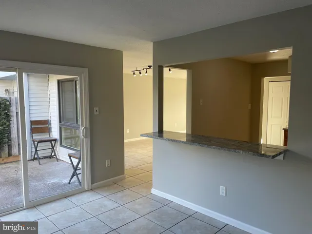 an empty room and glass door