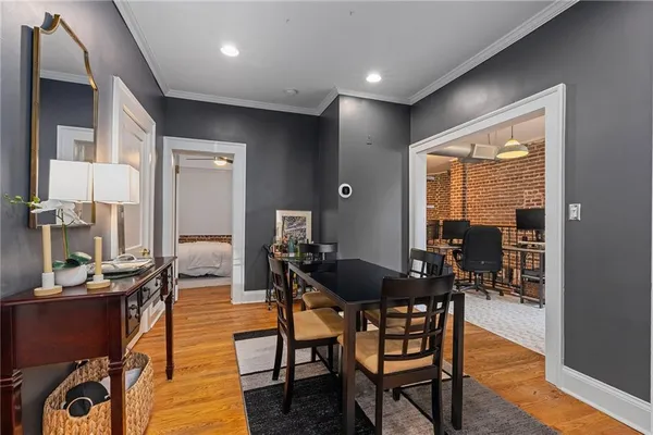 a view of a dining room with furniture window and wooden floor