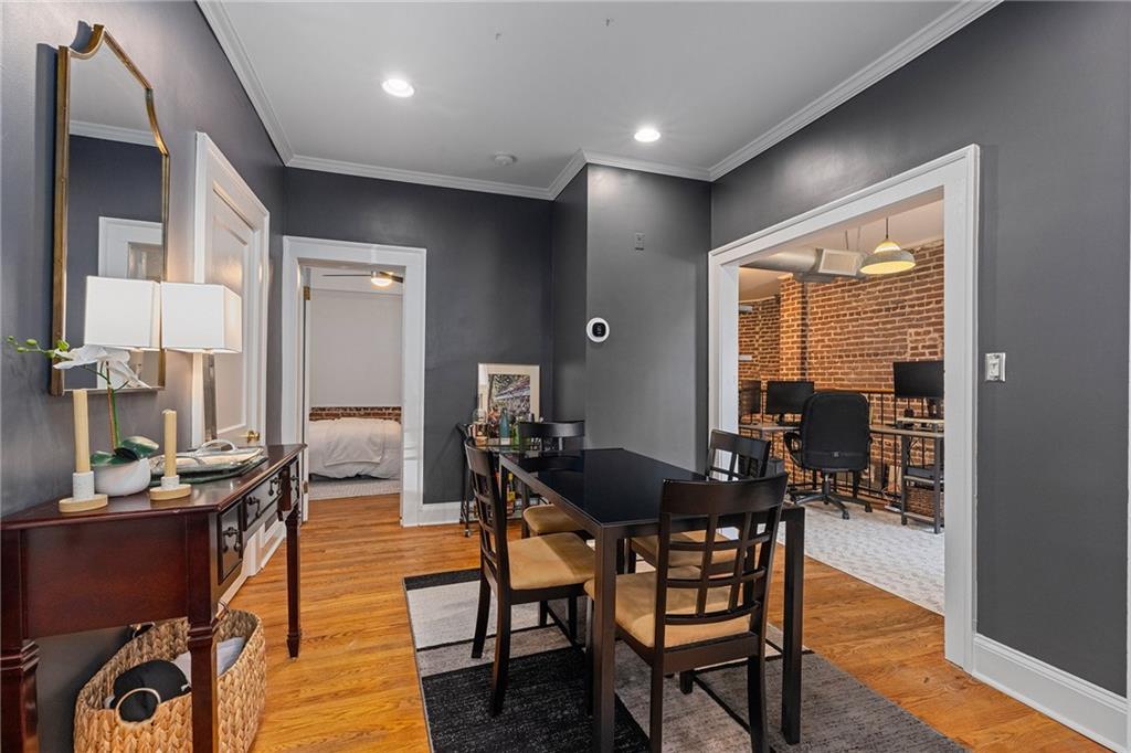 155 3rd Street Northeast, Unit 12 Atlanta, GA 30308 - Photo 11 of 36 a view of a dining room with furniture window and wooden floor
