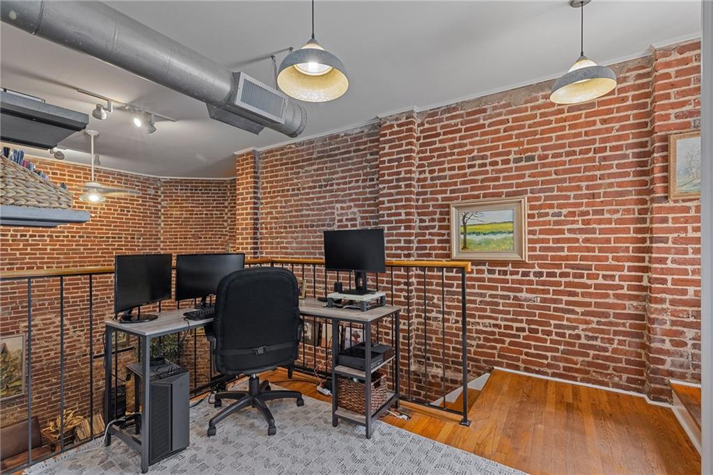 155 3rd Street Northeast, Unit 12 Atlanta, GA 30308 - Photo 12 of 36 a view of a workspace with furniture