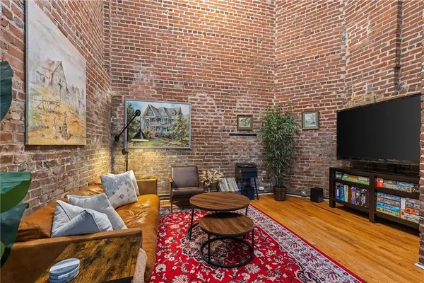 a outdoor living space with furniture and a flat screen tv