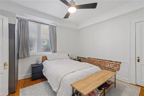 a bedroom with a bed and window