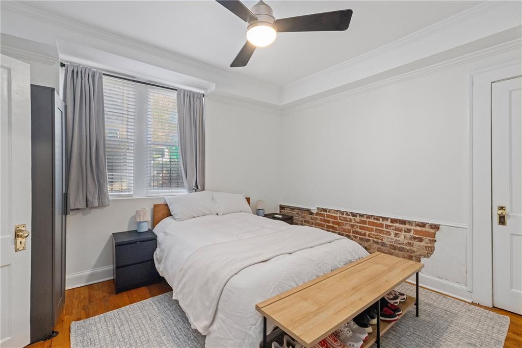 155 3rd Street Northeast, Unit 12 Atlanta, GA 30308 - Photo 21 of 36 a bedroom with a bed and window