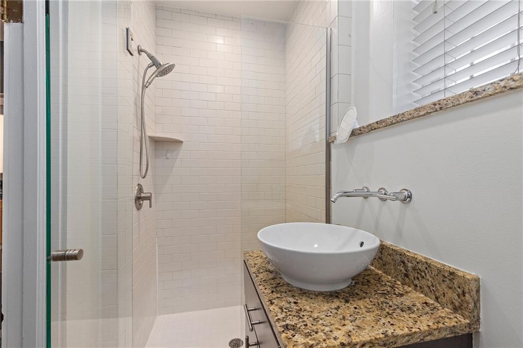 155 3rd Street Northeast, Unit 12 Atlanta, GA 30308 - Photo 26 of 36 a bathroom with a toilet and a shower
