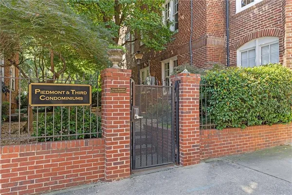 a sign on the side of a brick building