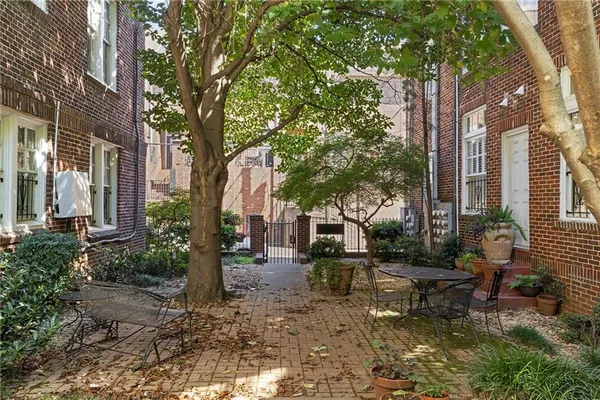 a backyard of a house with outdoor seating