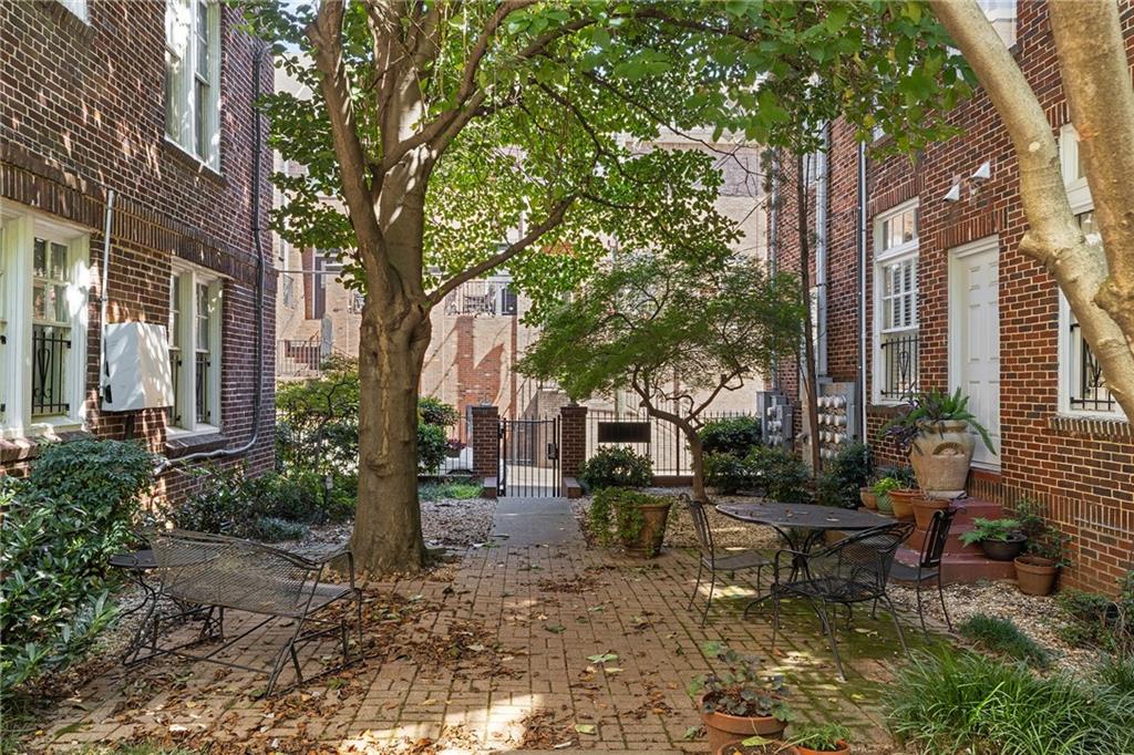 155 3rd Street Northeast, Unit 12 Atlanta, GA 30308 - Photo 36 of 36 a backyard of a house with outdoor seating