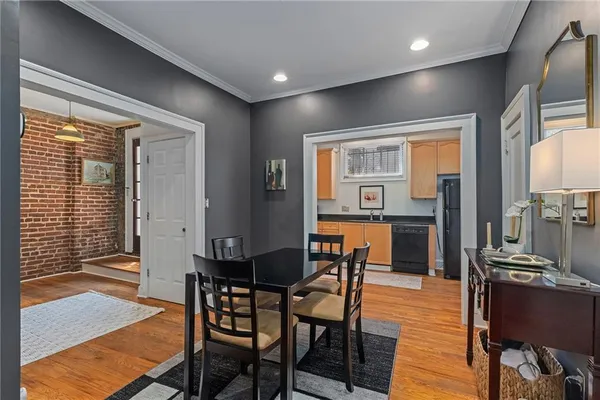 a view of a dining room with furniture window and wooden floor