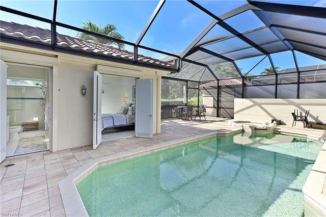 a bathroom with a granite countertop sink toilet and a mirror