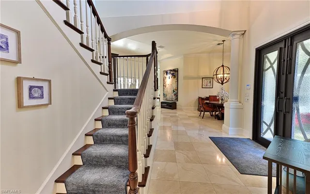 a kitchen with a sink a stove and cabinets