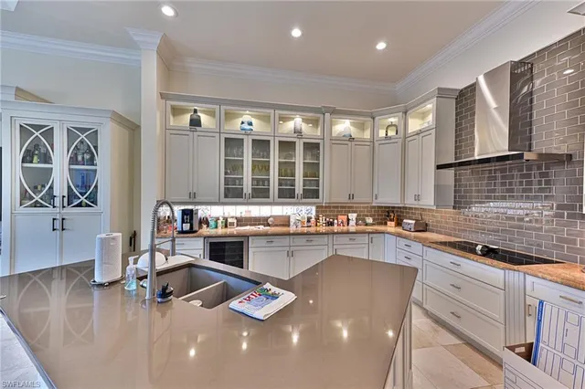 a kitchen with stainless steel appliances granite countertop a sink counter space cabinets and a large window