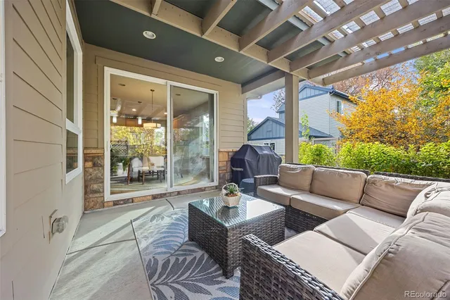 a outdoor living space with patio furniture and a garden