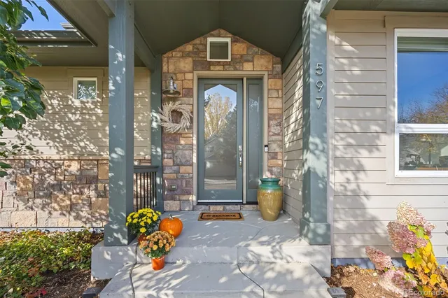 a front view of a house with outdoor seating
