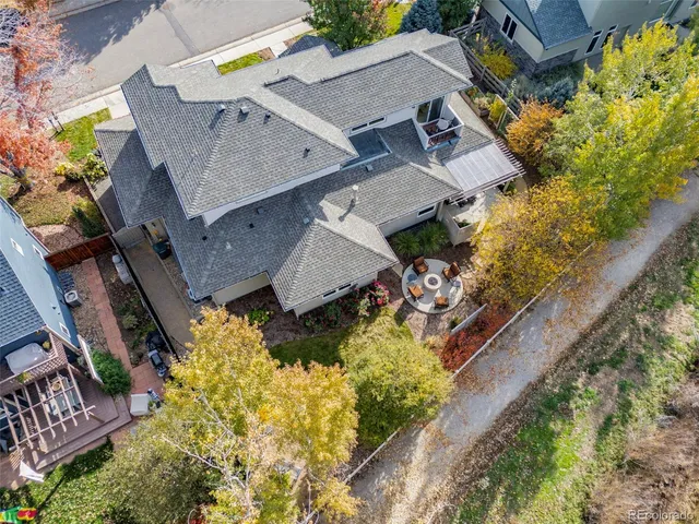 an aerial view of a house with a swimming pool
