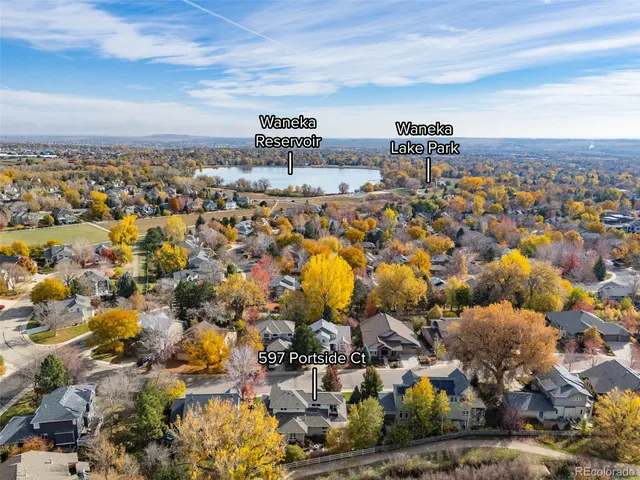 an aerial view of multiple house with yard