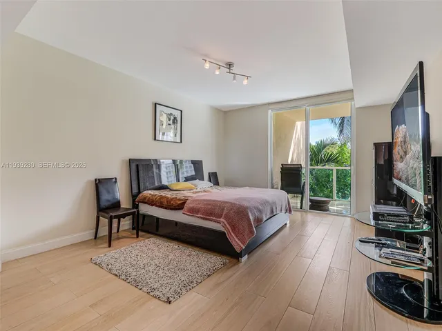 a bedroom with a bed and a view of bathroom
