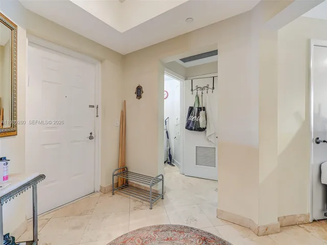 a bathroom with a sink toilet and a mirror