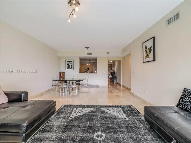 a kitchen with granite countertop cabinets stainless steel appliances and a counter space