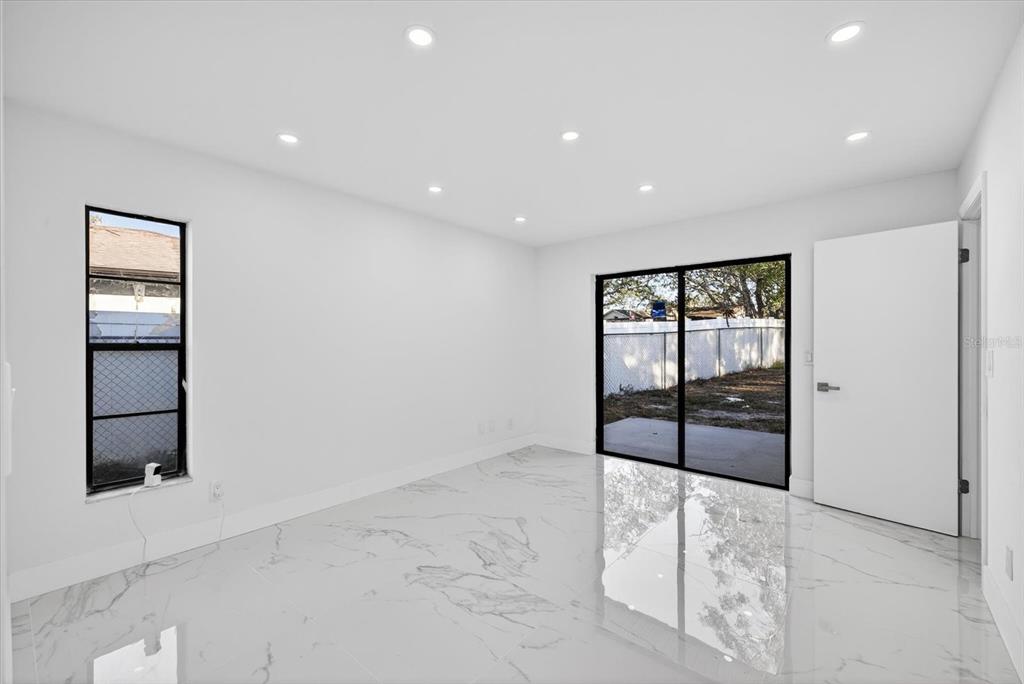 8078 Pagoda Drive Spring Hill, FL 34606 - Photo 20 of 54 an empty room with windows and closet