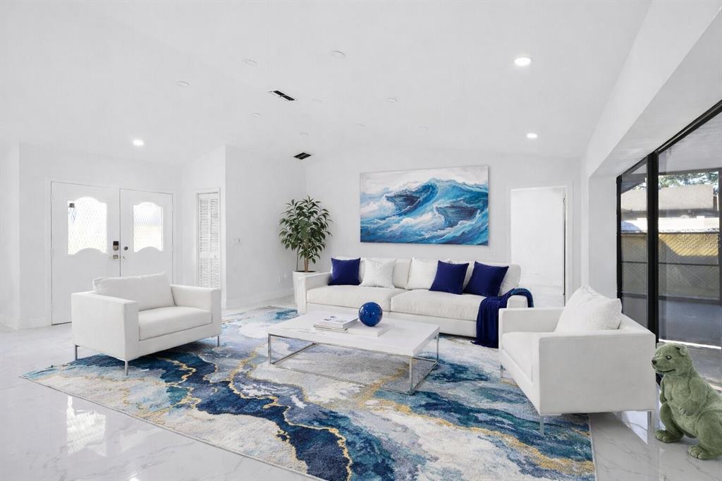 8078 Pagoda Drive Spring Hill, FL 34606 - Photo 2 of 54 a living room with furniture and a large window