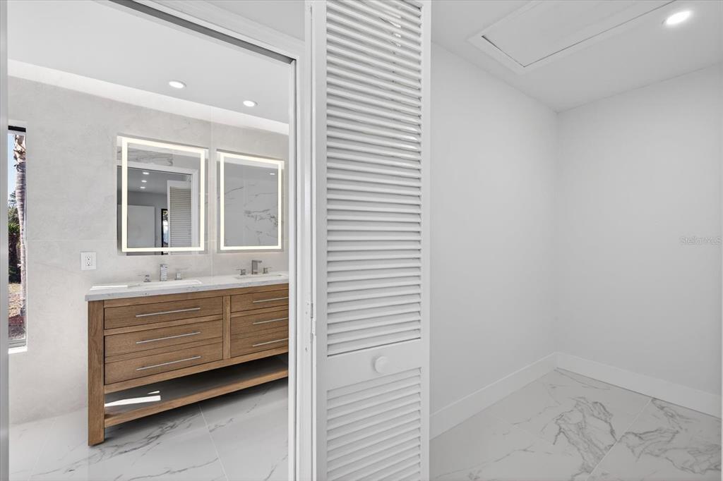 8078 Pagoda Drive Spring Hill, FL 34606 - Photo 23 of 54 a bathroom with a sink and a mirror