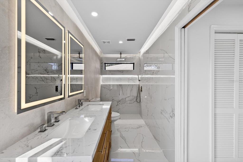 8078 Pagoda Drive Spring Hill, FL 34606 - Photo 24 of 54 a bathroom with a sink and a mirror