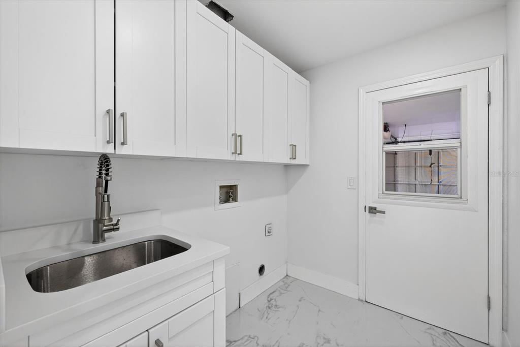 8078 Pagoda Drive Spring Hill, FL 34606 - Photo 32 of 54 a view white cabinets and a sink