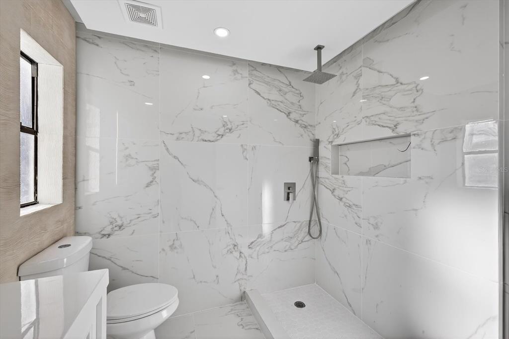 8078 Pagoda Drive Spring Hill, FL 34606 - Photo 35 of 54 a bathroom with a shower and a toilet