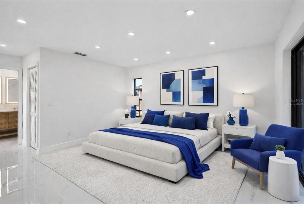 8078 Pagoda Drive Spring Hill, FL 34606 - Photo 4 of 54 a spacious bedroom with a bed and a couch