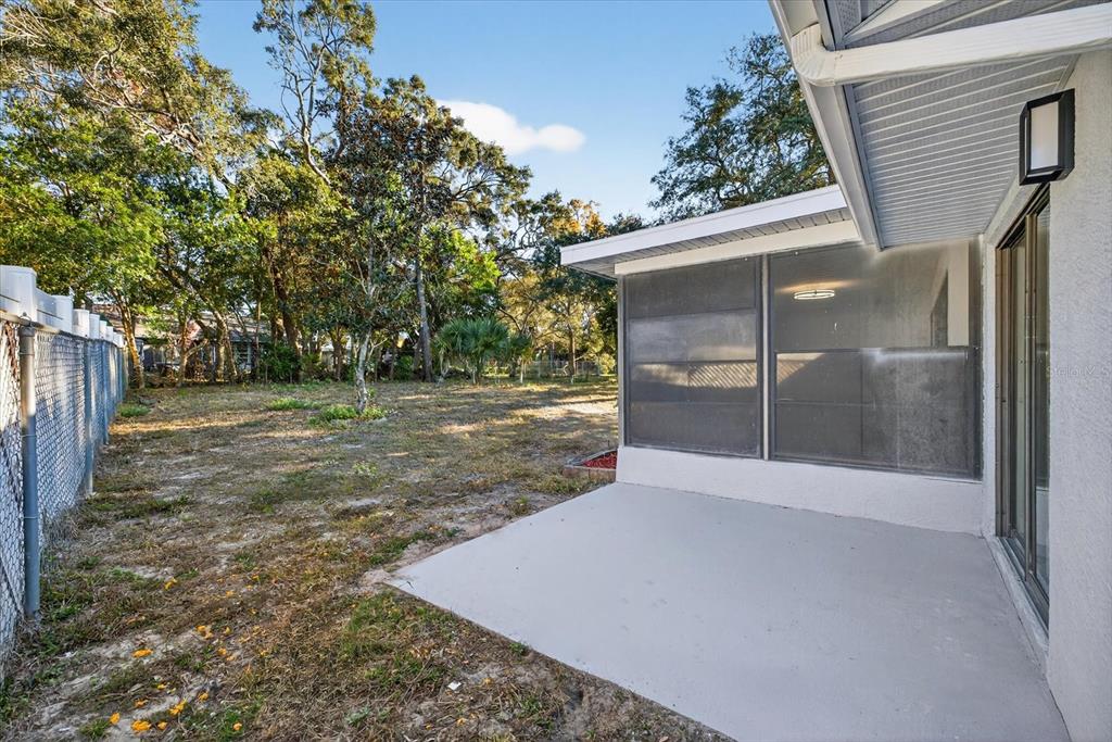 8078 Pagoda Drive Spring Hill, FL 34606 - Photo 43 of 54 a view of a yard with wooden fence