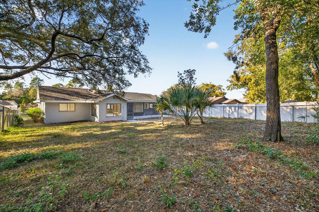8078 Pagoda Drive Spring Hill, FL 34606 - Photo 46 of 54 a view of a house with a yard