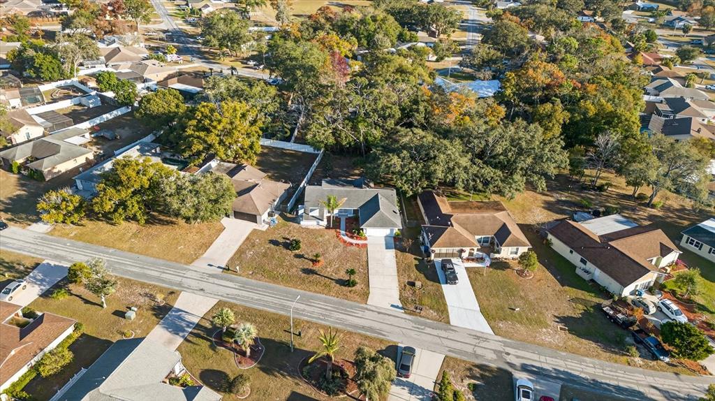 8078 Pagoda Drive Spring Hill, FL 34606 - Photo 51 of 54 an aerial view of a residential apartment building with a yard