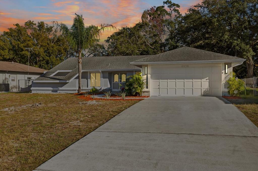 8078 Pagoda Drive Spring Hill, FL 34606 - Photo 54 of 54 a front view of a house with garden